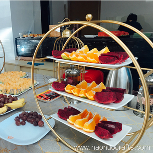 tea and fruit dessert wrapped three levels rack